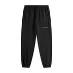 Black jogger pants with a logo on a white background