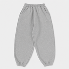 Gray sweatpants with a brand logo on a light gray background