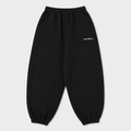 Black sweatpants with a brand logo on a light gray background